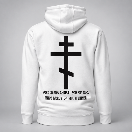 White pullover hoodie shown from the back, featuring a large black Eastern Orthodox cross graphic and the text 'Lord Jesus Christ, Son of God, Have Mercy On Me, A Sinner' printed on the back.