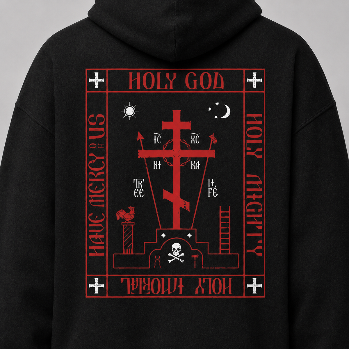 A black hoodie shown from the back, featuring a large red graphic print with a cross, religious symbols, and the text 'HOLY GOD' and 'HOLY MIGHTY'.