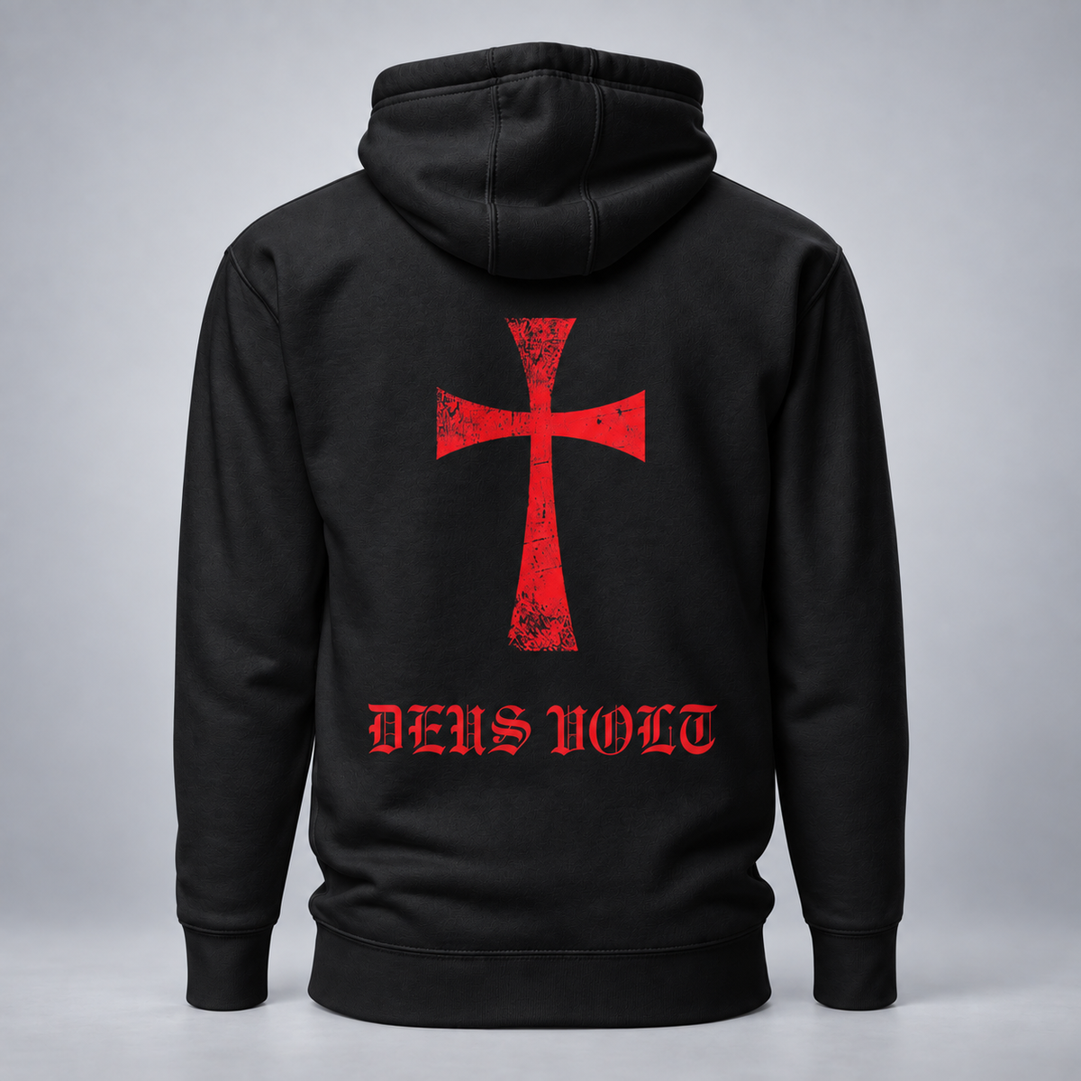 A black pullover hoodie shown from the back, featuring a large distressed red cross graphic and the words 'DEUS VOLT' in red gothic lettering below it, set against a neutral gray background.