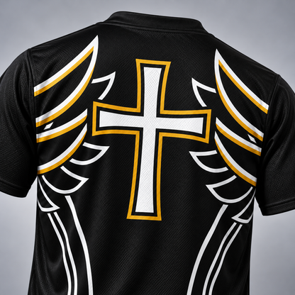 Close-up of the back of a black athletic jersey with a large white cross outlined in gold down the center, flanked by white and gold wing-like graphics on both sides.