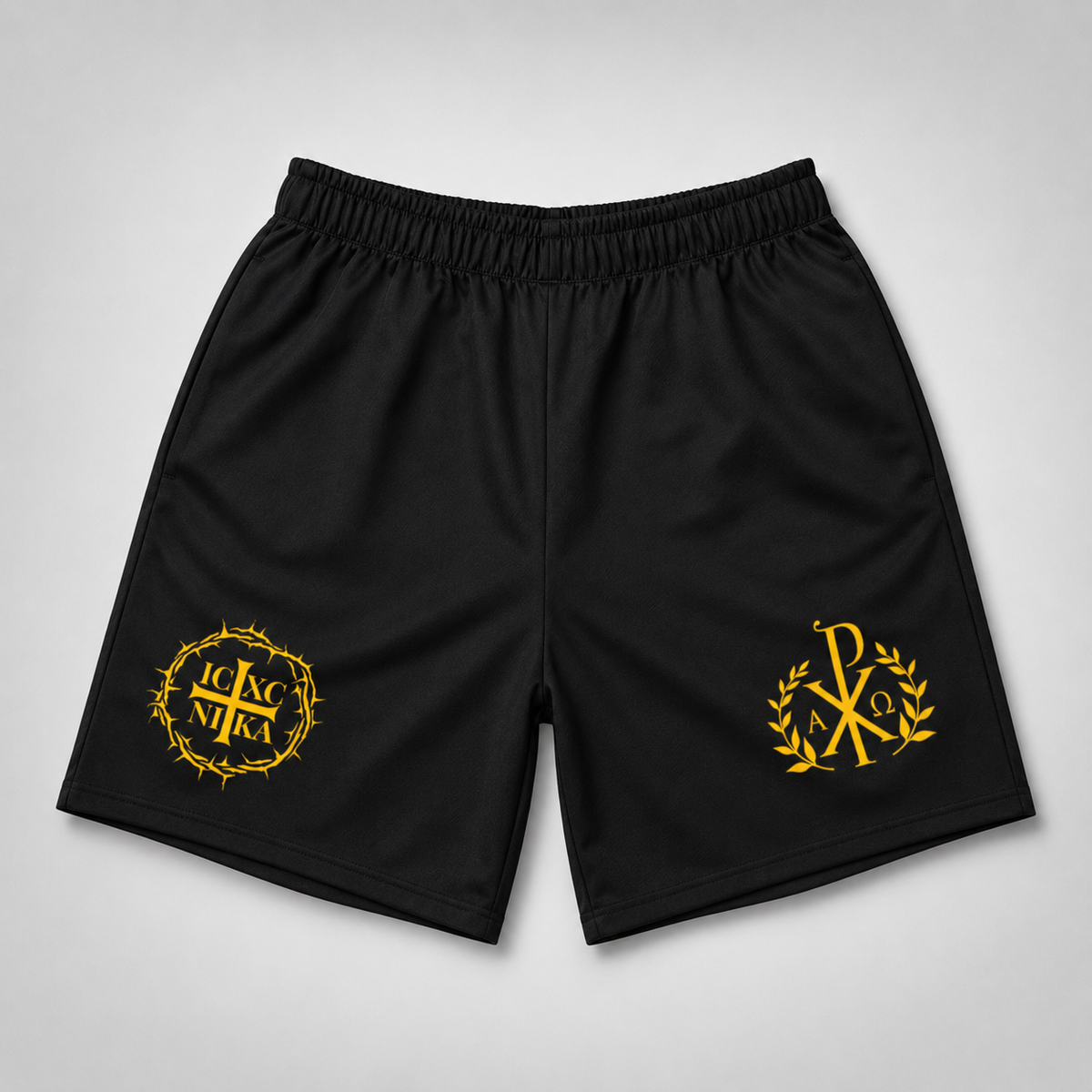 Black athletic shorts with yellow embroidered monogram logos on both legs, displayed flat against a light gray background.