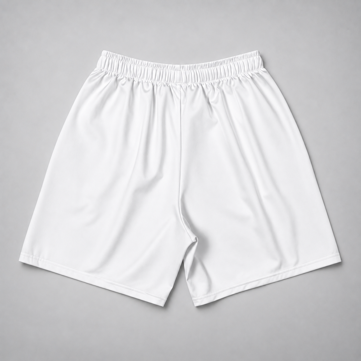White athletic shorts with an elastic waistband, laid flat on a neutral gray background.